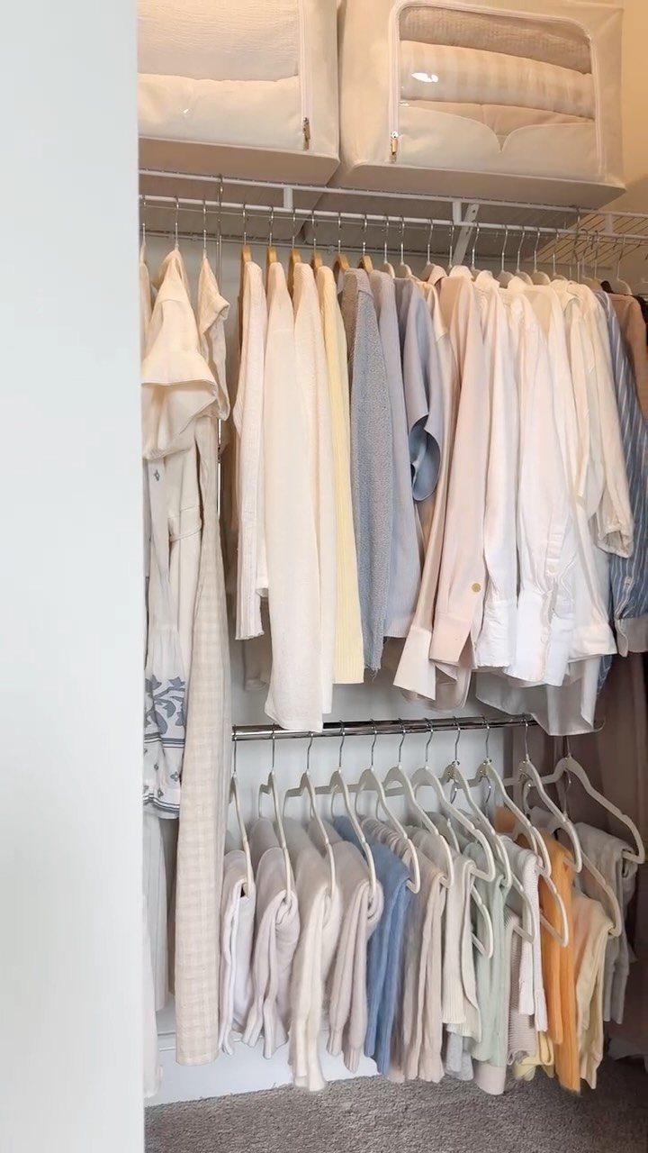 6 Closet Organization for Dresses Ideas That Save Space and Time 4 Light colored clothing hanging on a double rod system inside a white closet.