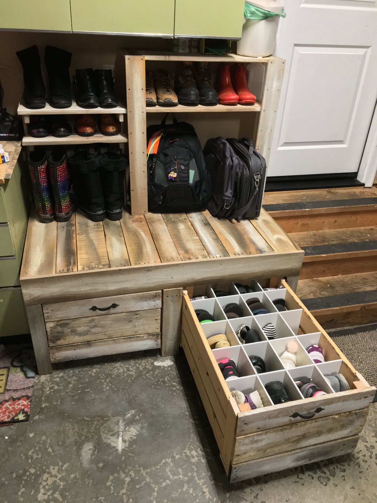 Wooden DIY storage bench with shelves for boots and backpacks and a matching shoe cubby organizer.