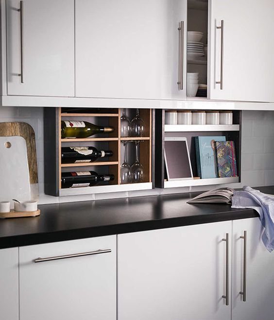 Pull Down Upper Cabinet: 5 Storage Solutions That Actually Work 5 Custom open shelving unit under white kitchen cabinets holding wine bottles and glassware.