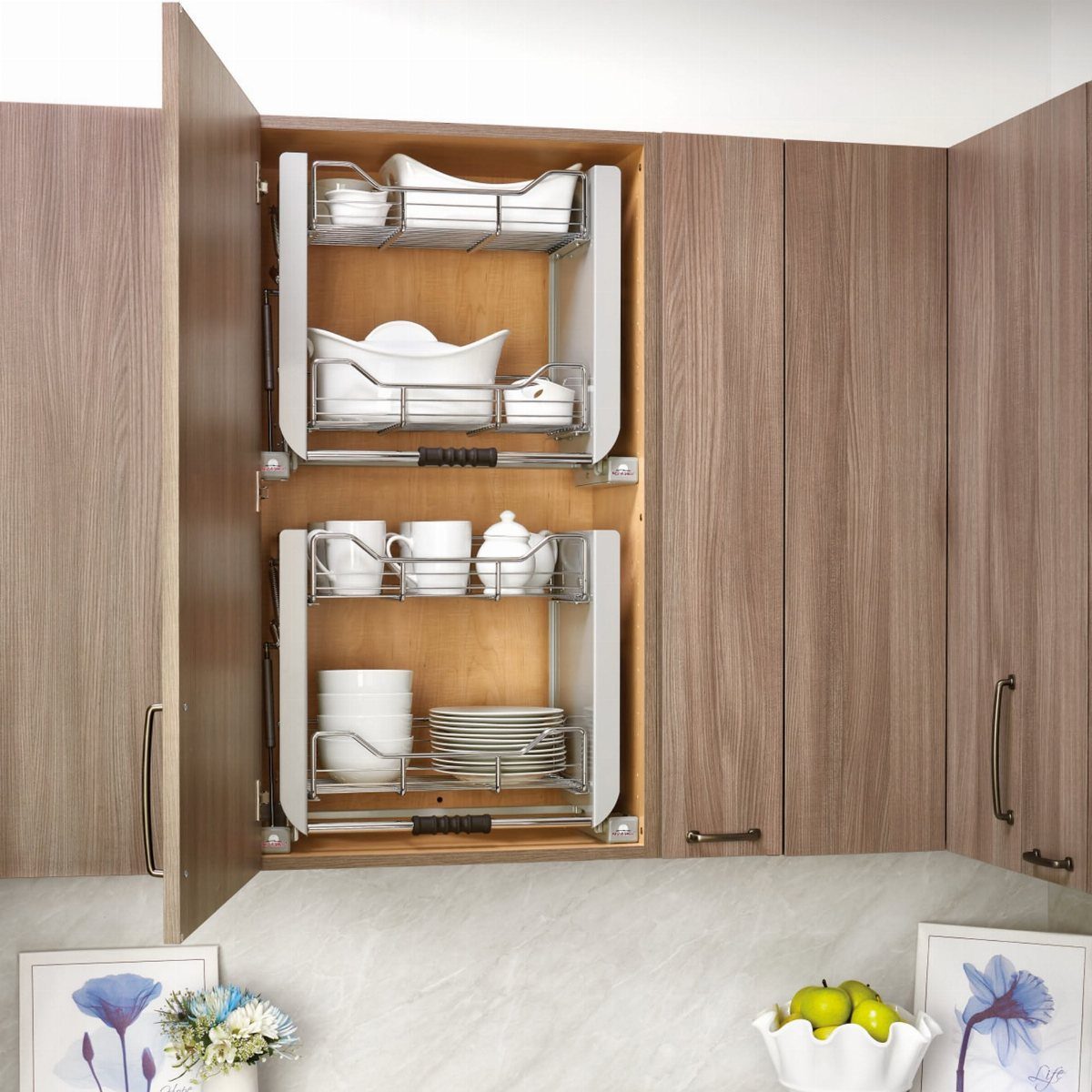 Pull Down Upper Cabinet: 5 Storage Solutions That Actually Work 3 White pull-down shelving units holding ceramic dishes inside an open wooden kitchen cabinet.