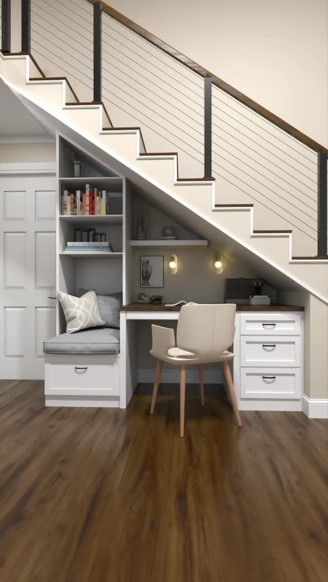 7 Stairs with Under Storage Ideas That Actually Work 5 A white built-in desk nook with shelving and a reading bench under a staircase.